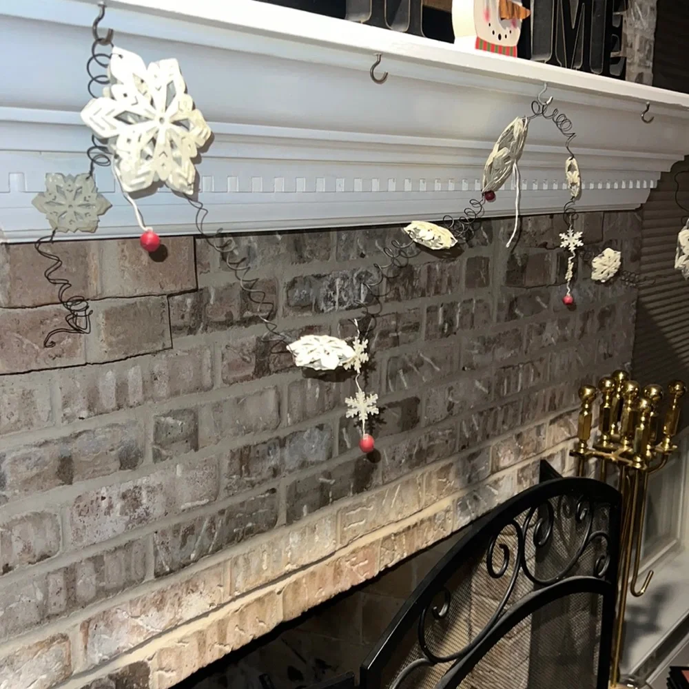 white snowflake metal wire garland with red jingle bells